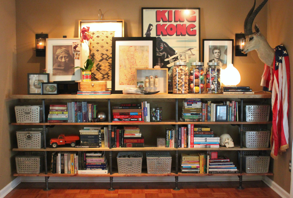 our finished plumbing pipe shelves in the living room